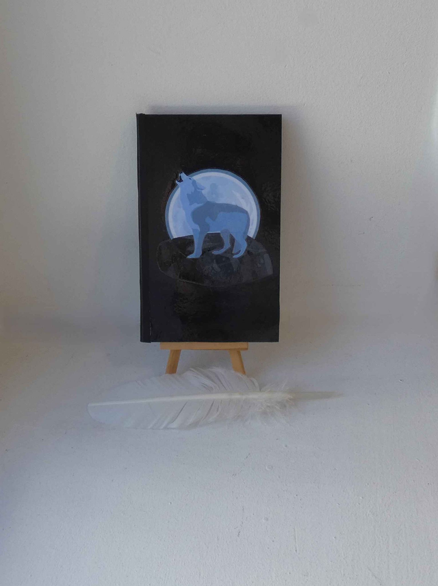 Le petit carnet quadriller aux loups hurlant à la lune