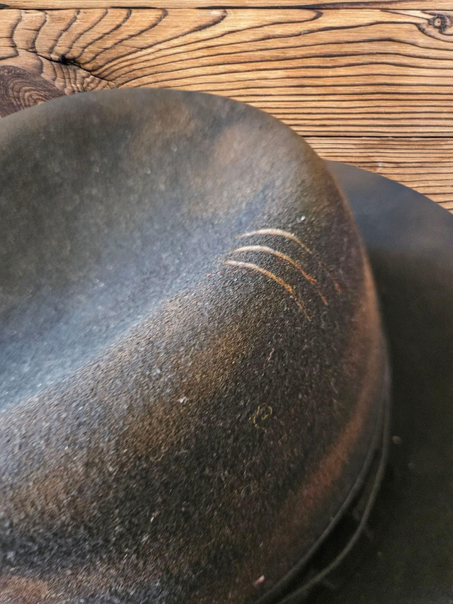 Distressed black fedora