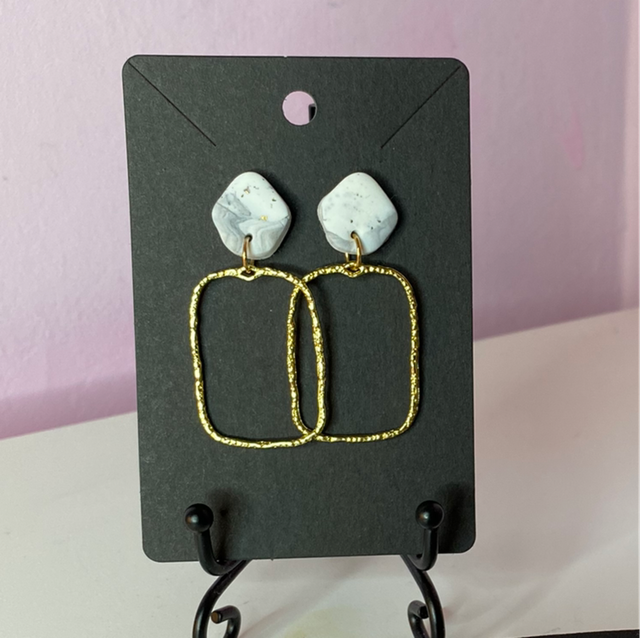 White Marvel Earrings With Gold Rectangular Accessories 