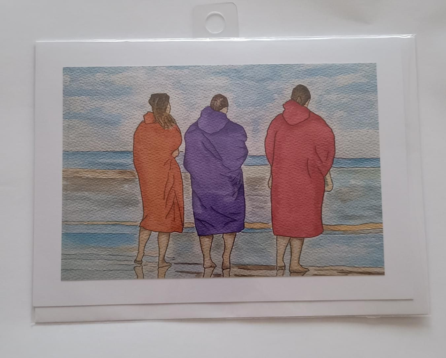 3 swimmers in robes