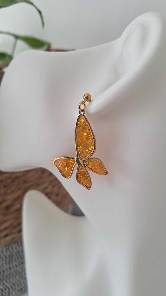 Boucles d&#039;oreilles papillons dorés orange et paillettes dorées