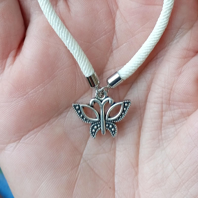 White kids bracelet with a Butterfly Charm