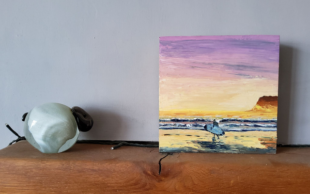 Surfer at sunset at Saltburn beach. Art card/Coaster