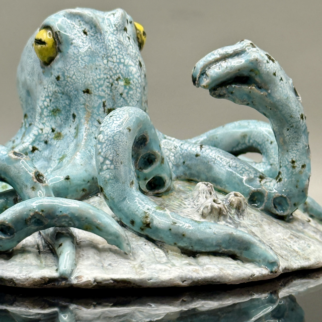 Italian hand gesture octopus on scallop shell