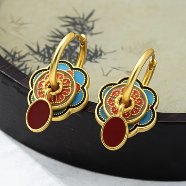 Triple charmed earrings
