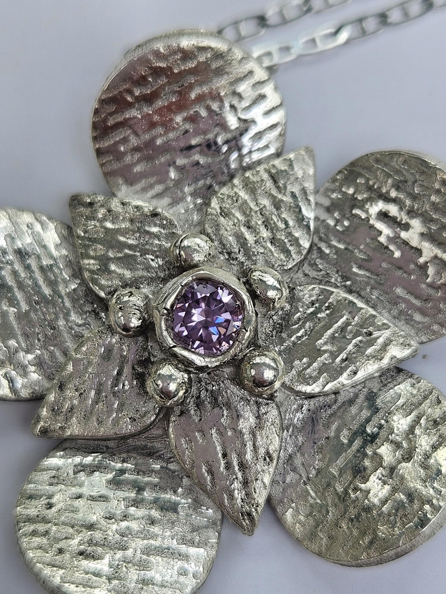Large textured flower with light amethyst cubic zirconia  fine silver pendant 