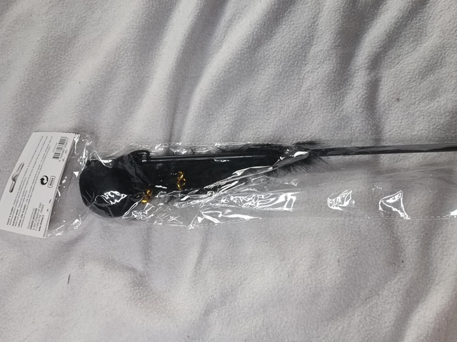 Canne pompon, grelot et plume