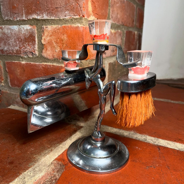 An Art Deco Crumb Tray Set On Stand In The Form Of A Deco Female