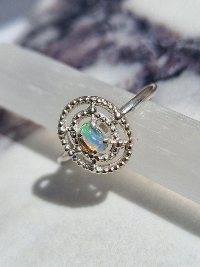 Natural Ethiopian Opal 5x3mm In a 925 silver beaded oval halo setting. smooth polished ring band 1.8mm