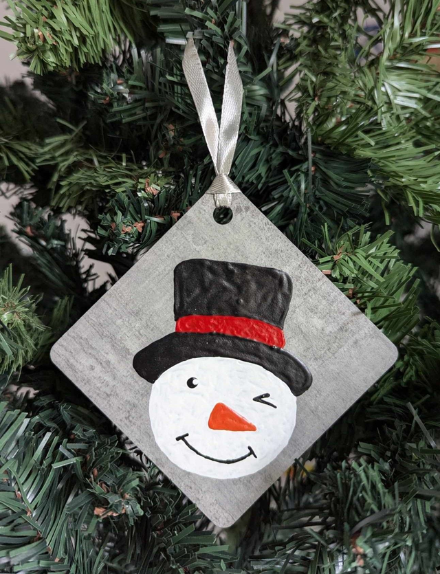 Tête bonhomme de neige 2024