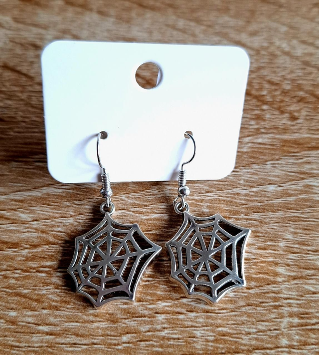 Silver tone spiderweb earrings 