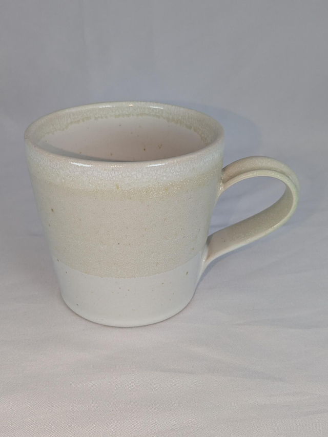 Cream and white mug