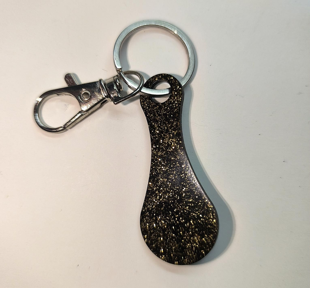 Jeton de caddie noir et doré 