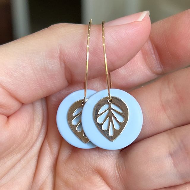 Hoop earrings with light blue clay and leaf charm
