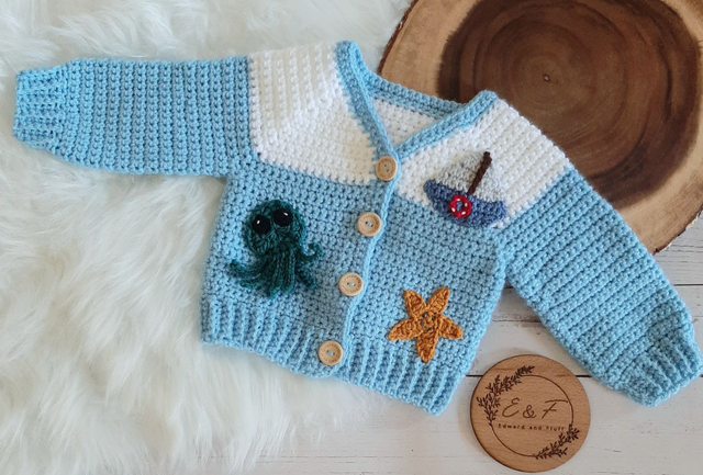 Handmade crochet baby cardigan with a nautical theme
