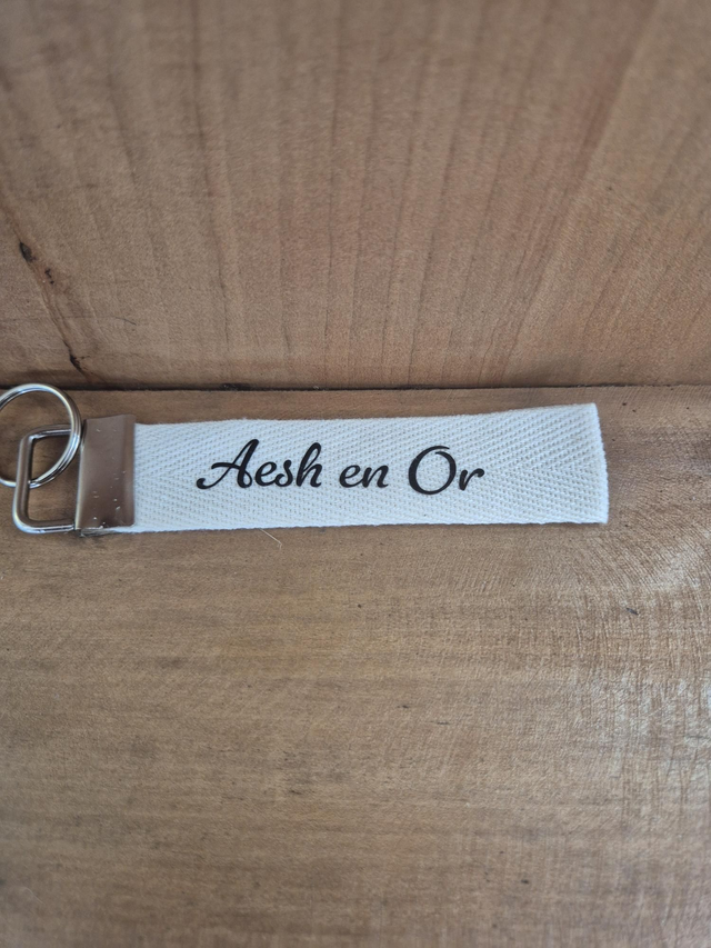 Porte clef ruban " Aesh en or"