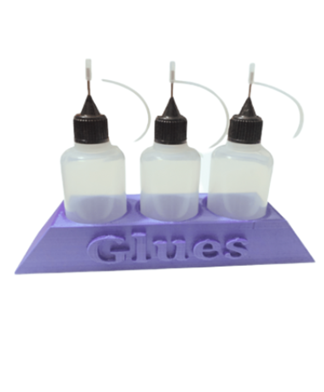Purple glue holder and glue bottles 