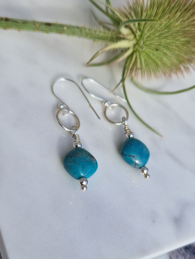 Sleeping Beauty Turquoise (Rare)10mm diamond Shaped stone 925 recycled silver drop earrings. Natural stone so this may vary in colour slightly. 1x Pr