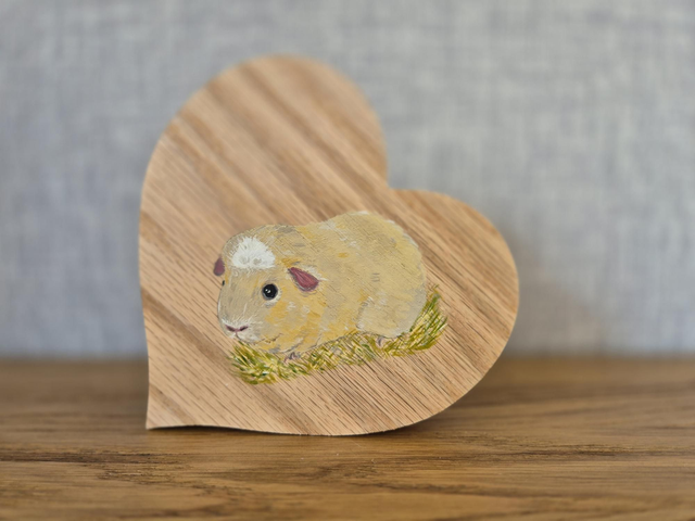 Guinea painted in acrylics, solid oak heart.