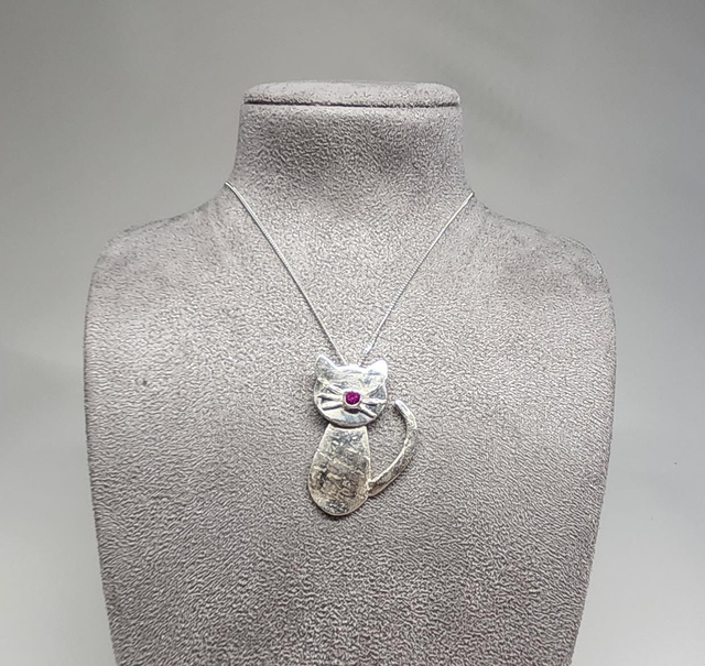 Cat pendant with fuchsia cubic zirconia on silver necklace