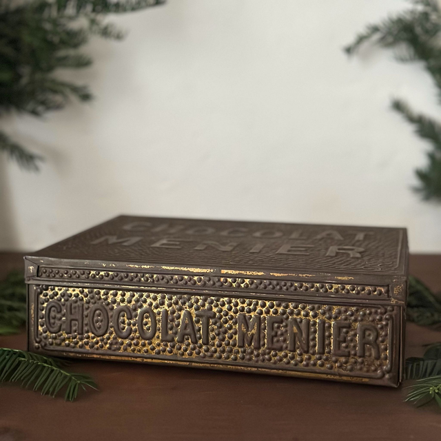 l'ancienne boîte en métal Chocolat Menier