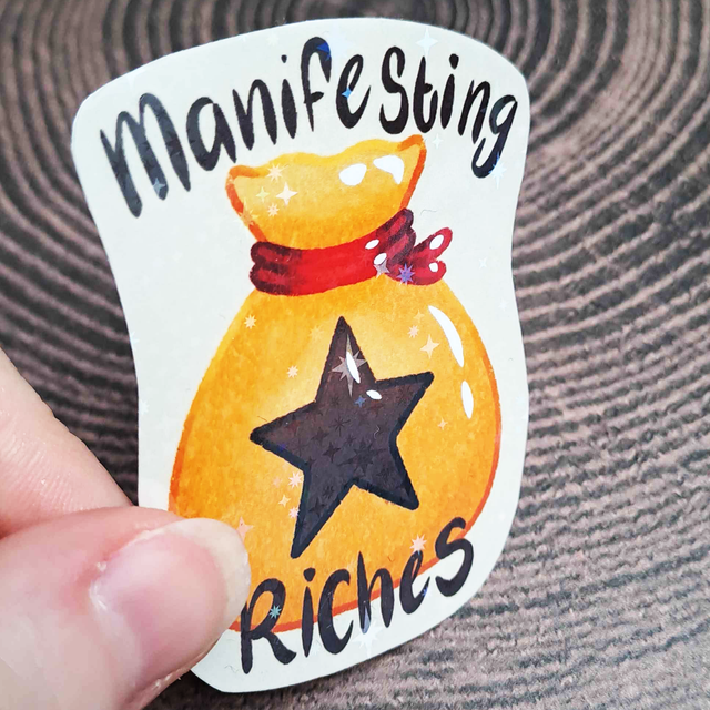 Manifesting Riches Holographic Sticker