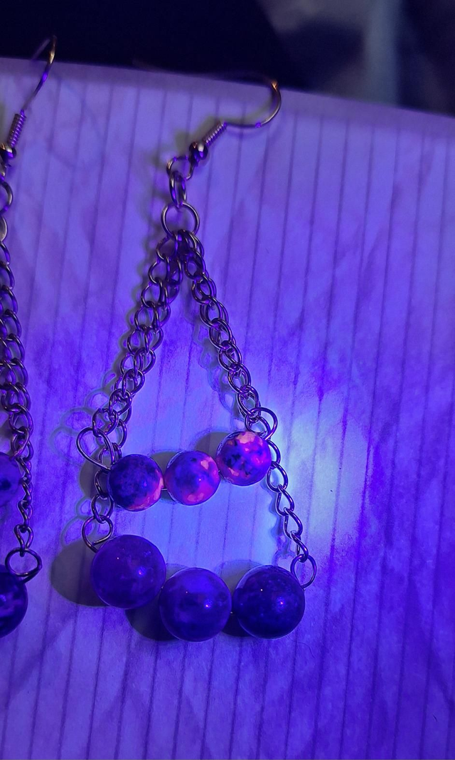 Leto's cradles in gold with AA grade yooperlite and red tourmaline, two earrings