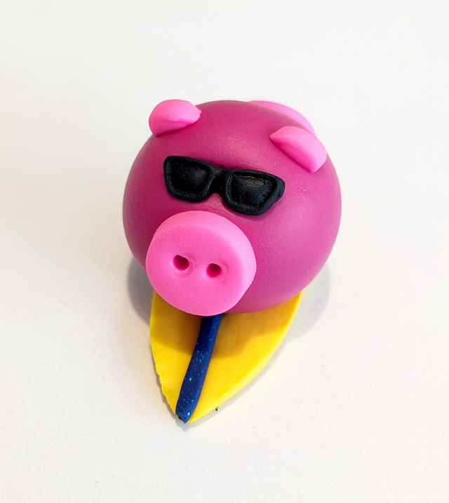 Pink surfing pig