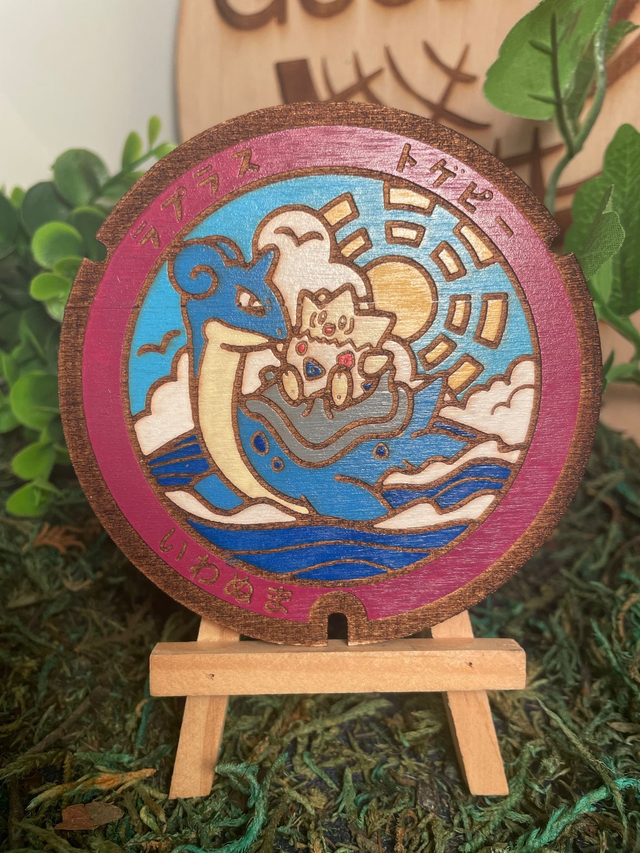 Plaque pokémon Lokhlass et Togepi.