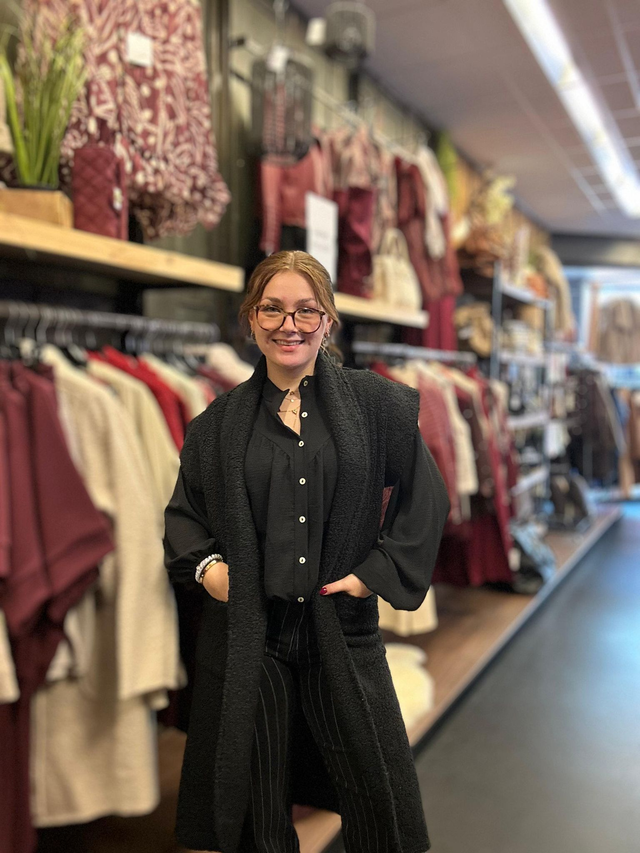 Gilet lang bouclé zwart