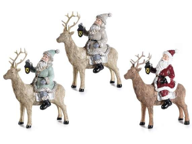 Babbo Natale in resina colorata su renna