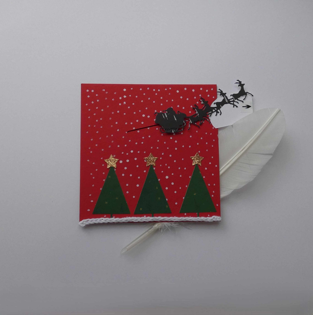 Joli traîneau au-dessus de la forêt (carte à tirette)
