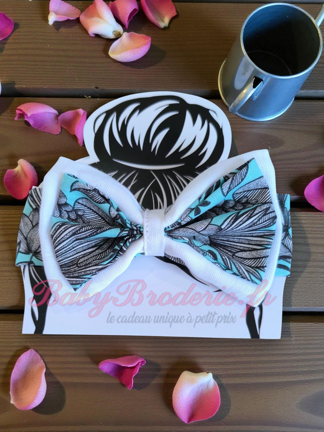 Bandeau bébé blanc et motif gris sur fond bleu turquoise