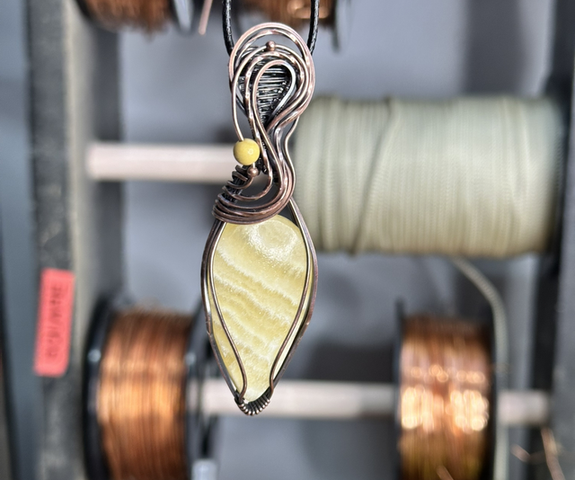 Orange Calcite pure copper wrapped pendant 