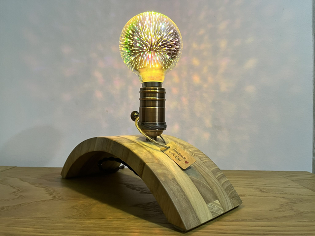 Stylish decorative lamp made of Paulownia wood with a 3D light bulb.