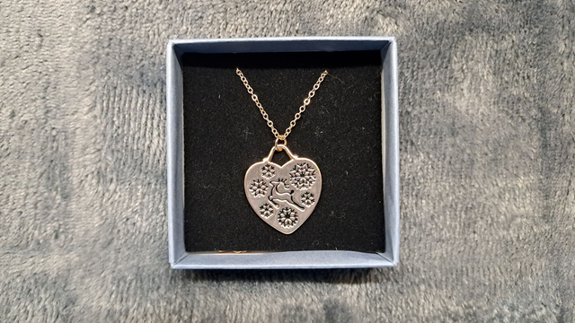 Rose Gold Coloured Reindeer and Snowflakes Heart Shaped Pendant Necklace.
