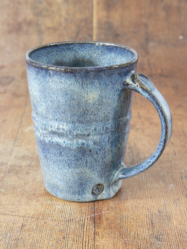 Straight sided coffee mug in flowing light blue