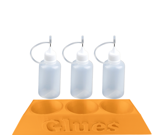 Orange glue holder and glue bottles 