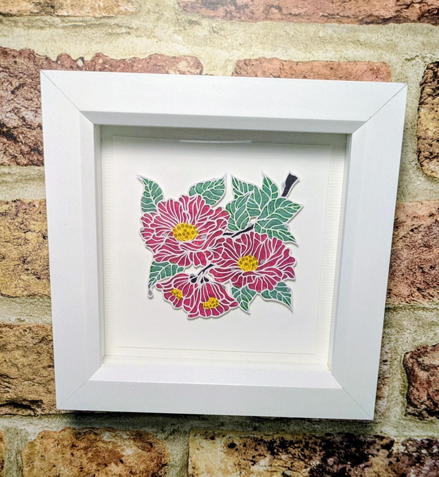 'Camellias' Paper Cut Art Print with Hand Decorated Details, in White Hanging Frame