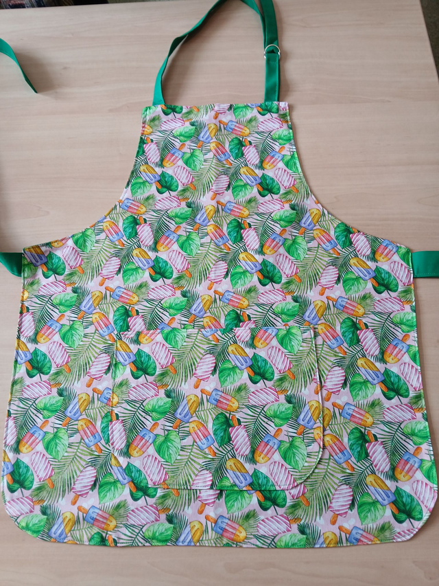 Childs Kitchen/Play Apron Lolly Leaves Cotton Fabric with lined Front pocket and green lining.
