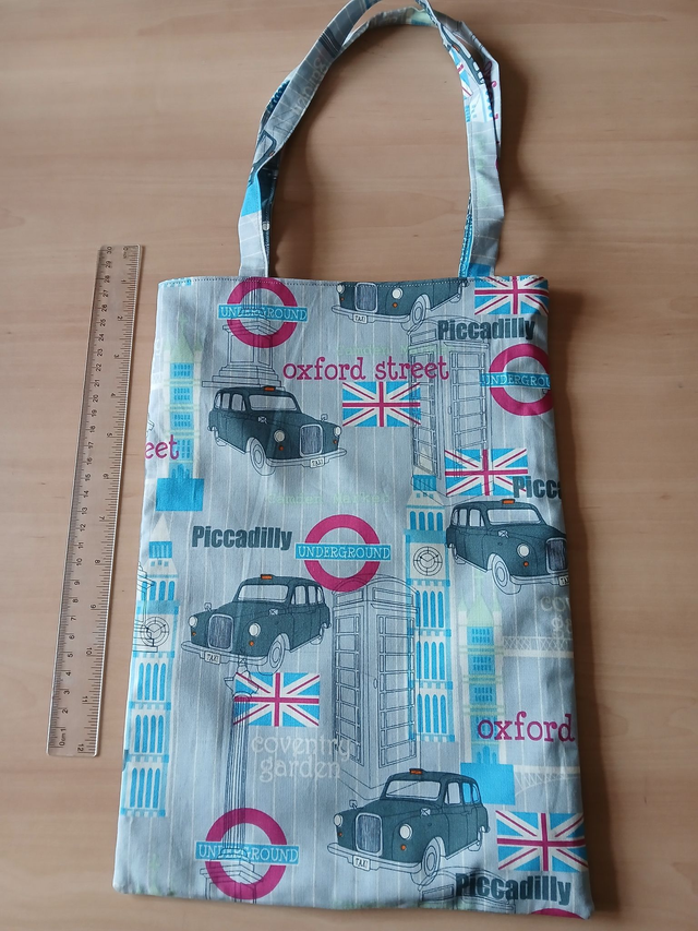 Fully lined Children&#039;s Tote/Toy bag Vehicle Print Cotton Fabric with synthetic fabric lining.