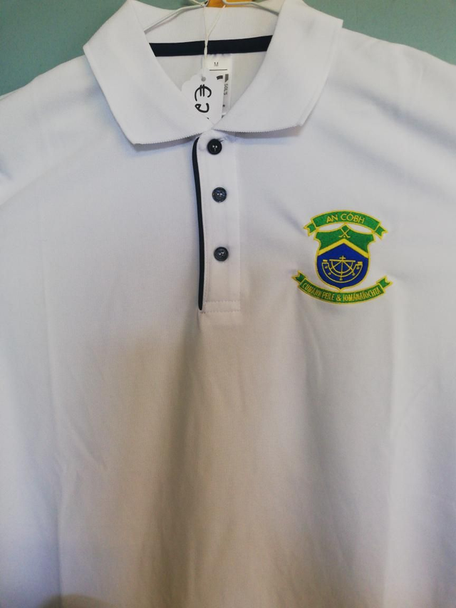 White polo with navy trim