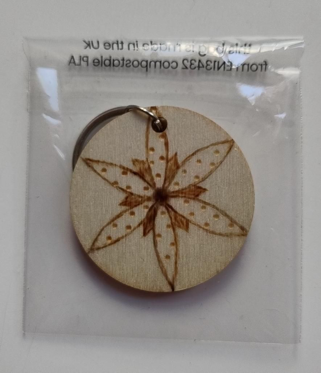 Keyring with flower and spiral designs