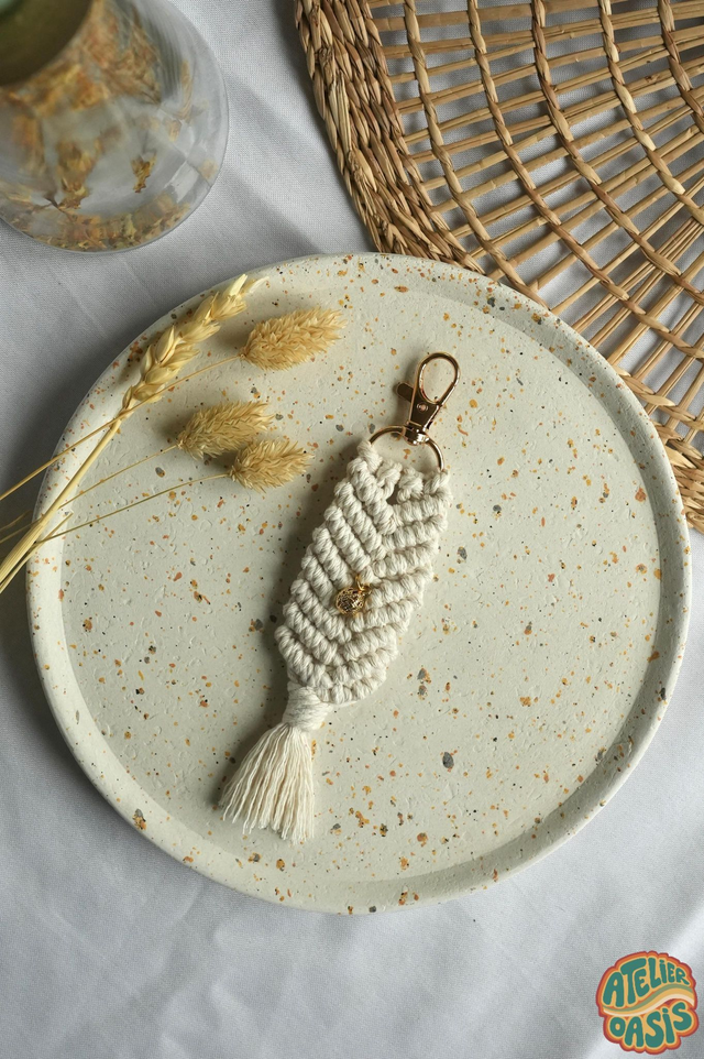 Porte-clé à breloque dorée