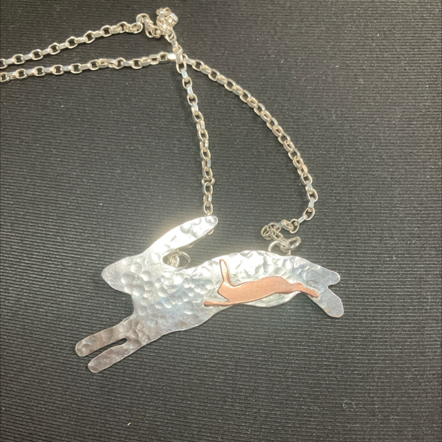 Running hare with leveret