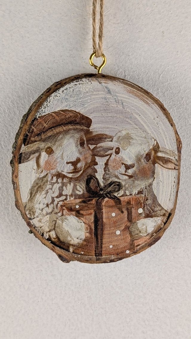 Sheep with gift, one in flat cap - Log slice