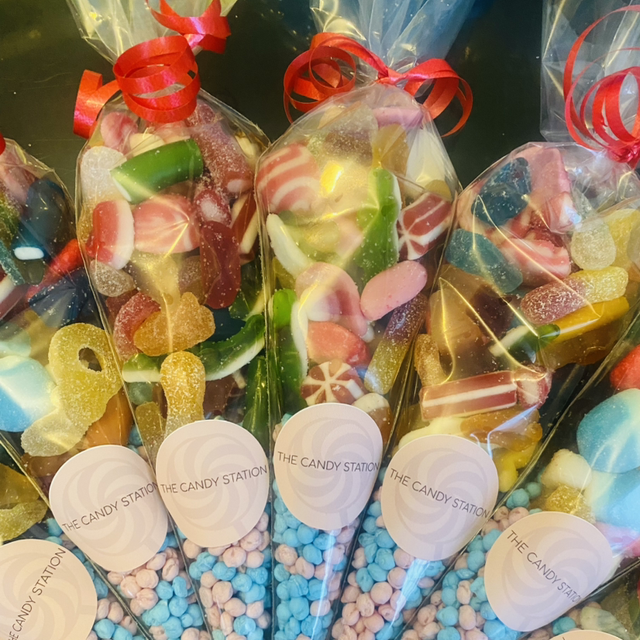 Sweet cones mixed with red ribbon