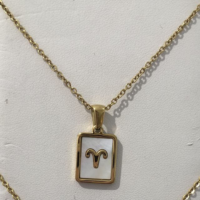 Pendentif inox nacre et astro bélier 