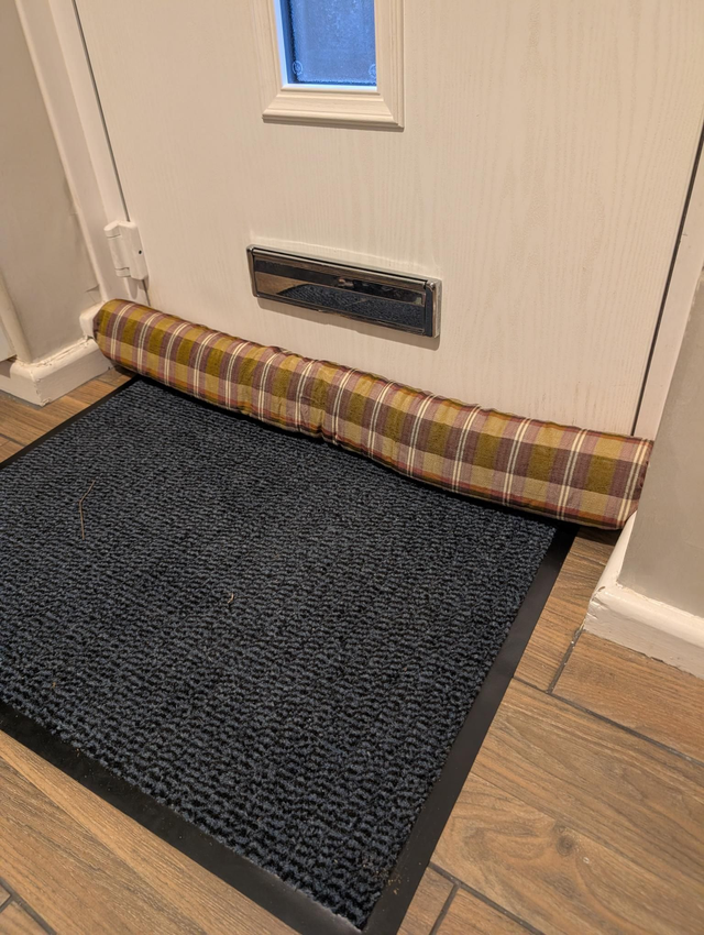 Rustic tartan draft excluder