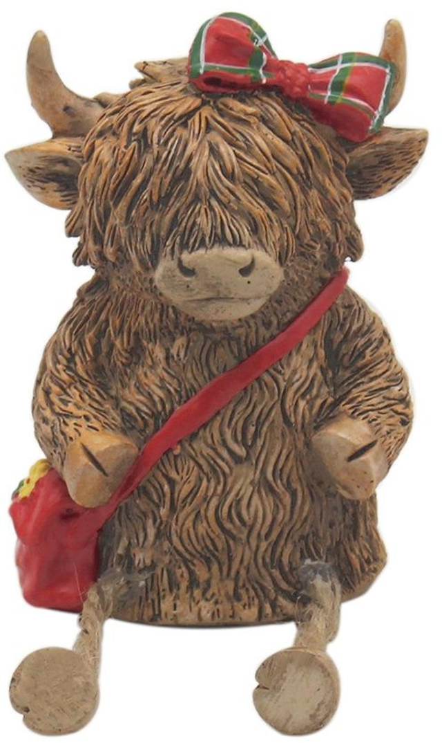 Highland cow with red bag